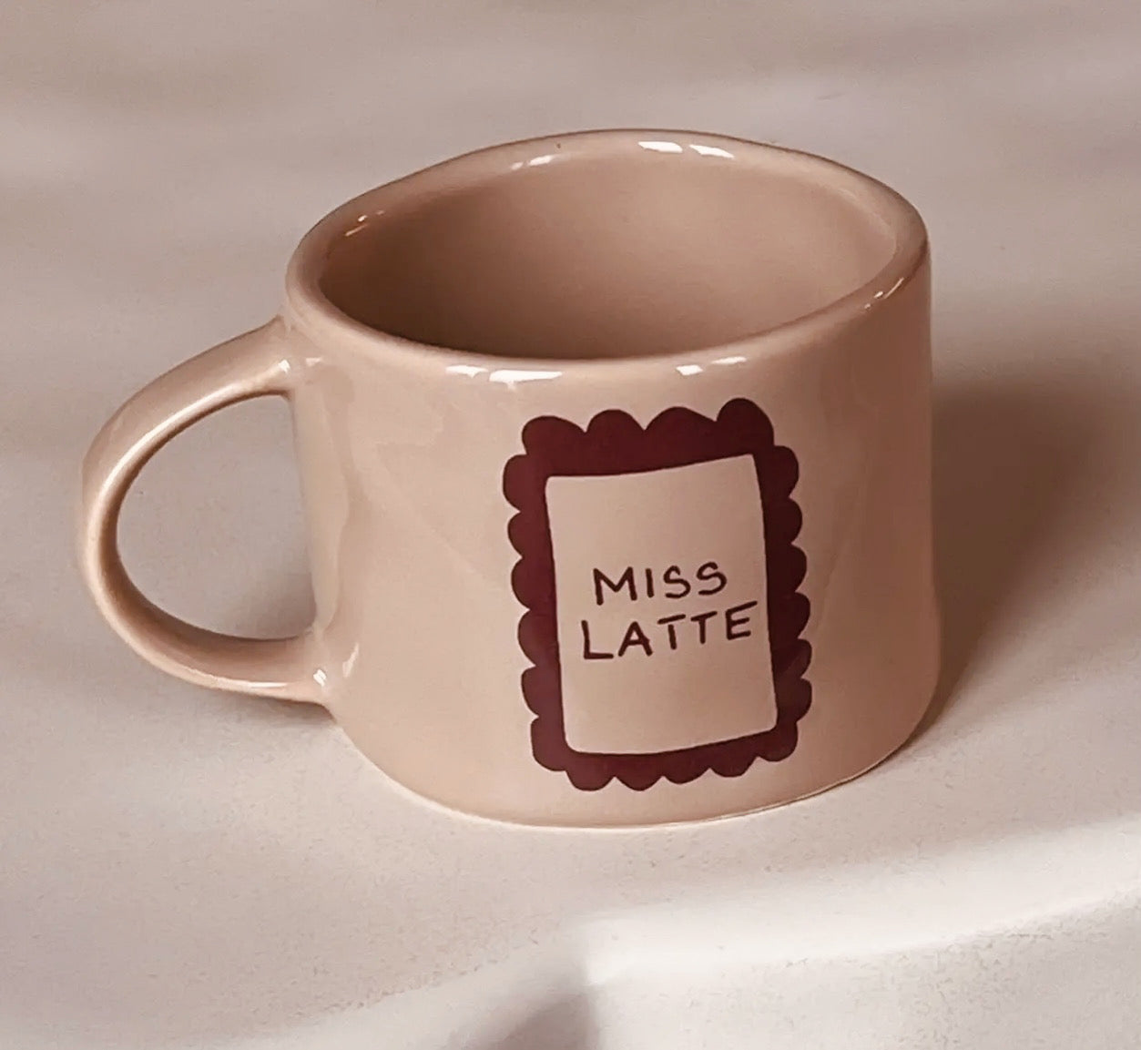 Kaffeetasse mit Aufschrift Miss Latte